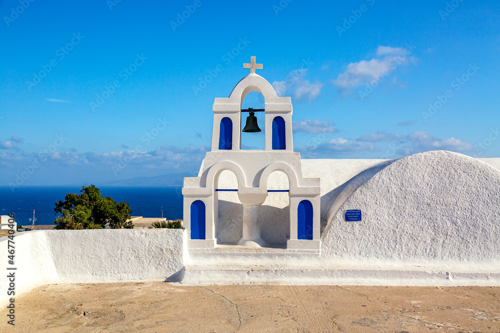 Famous Santorini iconic view. Holy trinity Agia Triada church in Oia village, Santorini island, Greece.