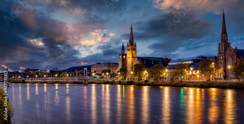 Panormic view of the cityscape of Inverness, Scotland, during evening time with Greig Street Bridge, River Ness and the old town