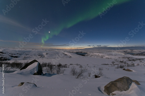 Beautiful aurora borealis in the tundra in winter. © Moroshka