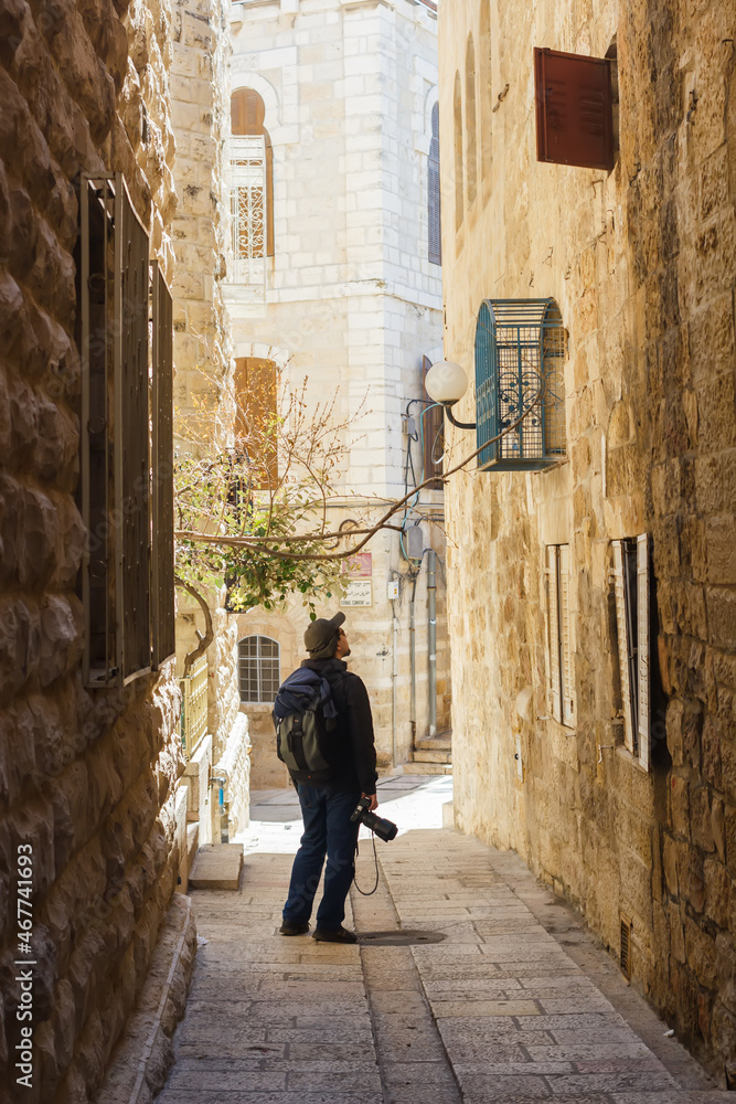 Tourist photographer on the streets of the old city of Jerusalem