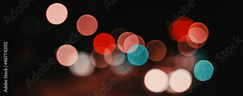Bright colored bokeh glare on dark background, festive christmas new year background