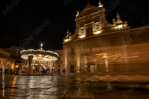 carousel and old church in lecce