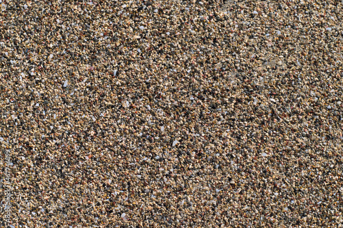 Beach sand of small, tiny pebbles and seashells