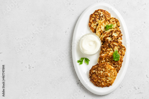 Wallpaper Mural Keto cheesy chicken fritters on white dish with sour cream sauce. Top view, space for text. Torontodigital.ca