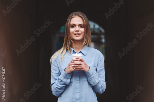 women outdoors drinking cup posing alleyway lifestyle