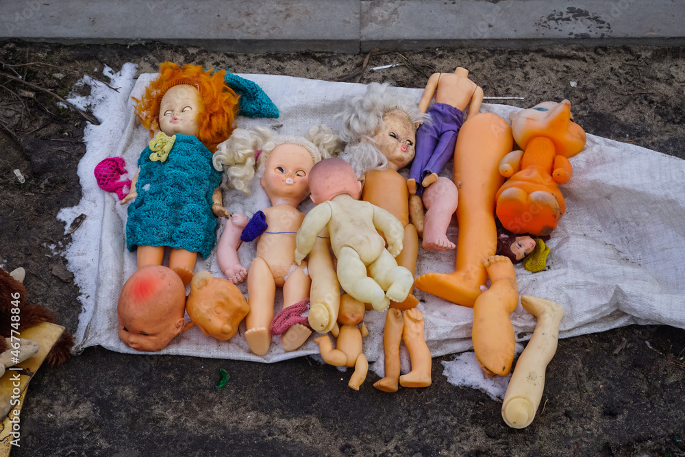 Old broken dolls at a flea market