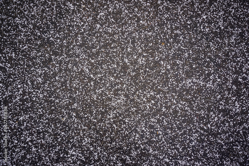 Snow crumbs on paving slabs, background