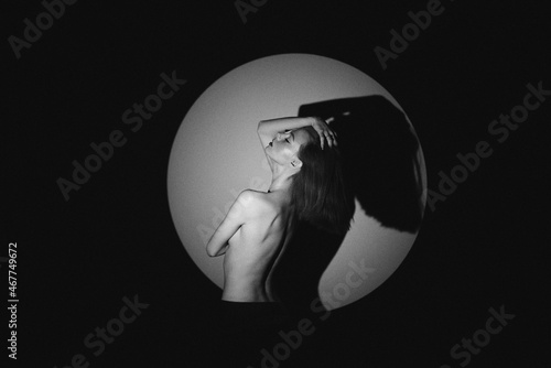 Beautiful girl posing in a photo studio. Shooting with gobo masks photo