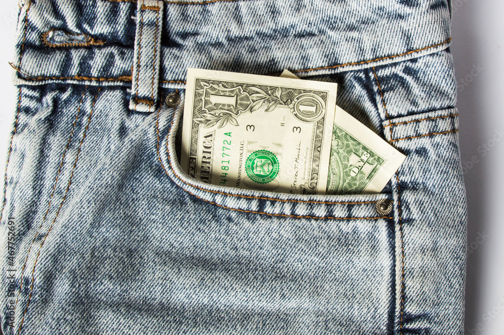 A dollar bill sticking out of a pocket of blue jeans, a credit card, and a wallet. Poverty and unemployment. Concept of financial problems, last money. Cash. Business, trade or financial transactions. A dollar bill sticking out of a pocket of blue jeans, a credit card, and a wallet. Poverty and unemployment. Concept of financial problems, last money. Cash. Business, trade or financial transactions.