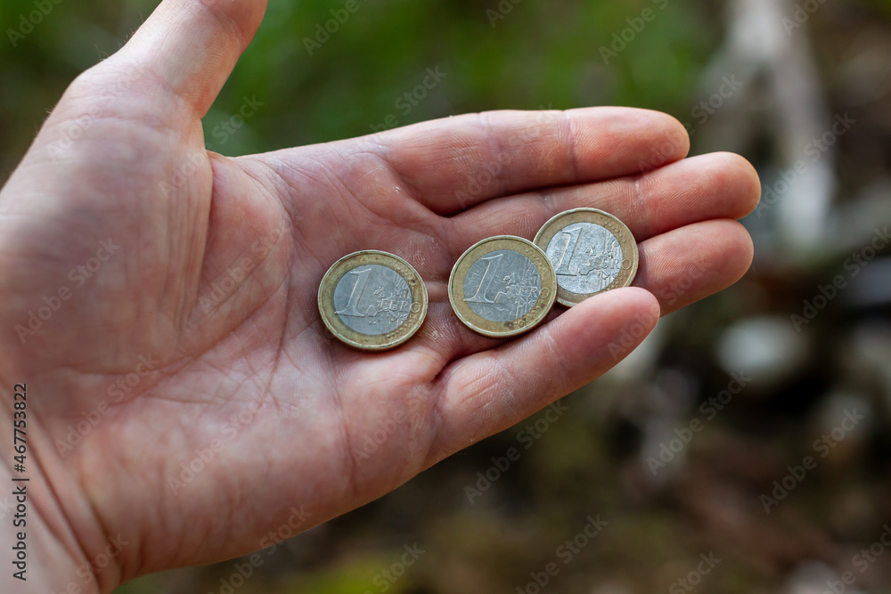 Giving money. Euro coins. Coins in hand. Giving money. Euro coins. Coins in hand.