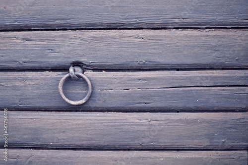 wooden wall with metal ring and copyspace