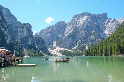 Lake Braies (also known as Pragser Wildsee or Lago di Braies) in Dolomites Mountains, Sudtirol, Italy. Romantic place with typical wooden boats on the alpine lake. Hiking travel and adventure. © Matteo