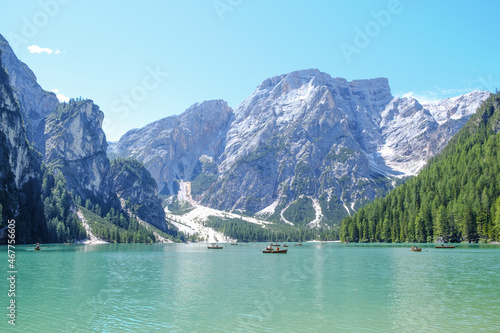 Lake Braies (also known as Pragser Wildsee or Lago di Braies) in Dolomites Mountains, Sudtirol, Italy. Romantic place with typical wooden boats on the alpine lake. Hiking travel and adventure.