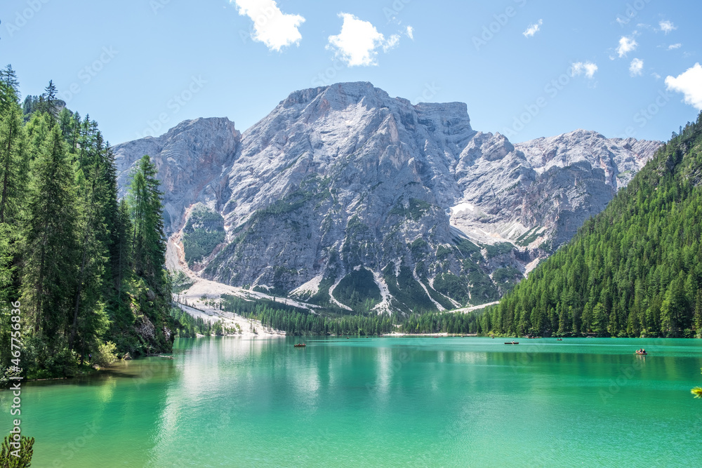 Lake Braies (also known as Pragser Wildsee or Lago di Braies) in Dolomites Mountains, Sudtirol, Italy. Romantic place with typical wooden boats on the alpine lake. Hiking travel and adventure. Lake Braies (also known as Pragser Wildsee or Lago di Braies) in Dolomites Mountains, Sudtirol, Italy. Romantic place with typical wooden boats on the alpine lake. Hiking travel and adventure.