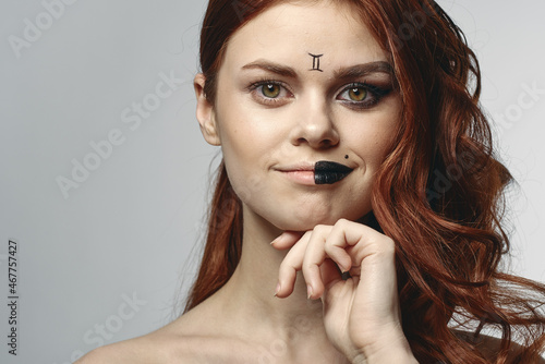 red-haired woman naked shoulders cosmetics horoscope close-up