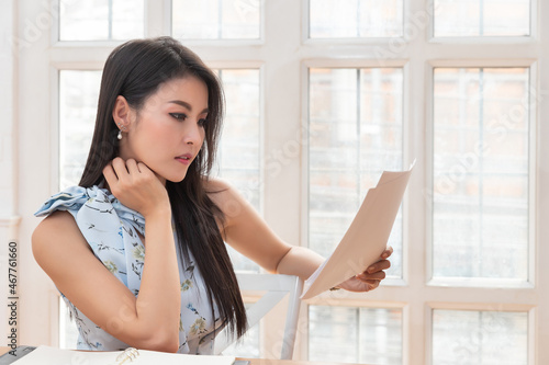 Young asian woman in smart casual wear working with laptop in home office. Social distance practice prevent coronavirus COVID-19. Free Download Young asian woman in smart casual wear working with laptop in home office. Social distance practice prevent coronavirus COVID-19. - GFXLoad