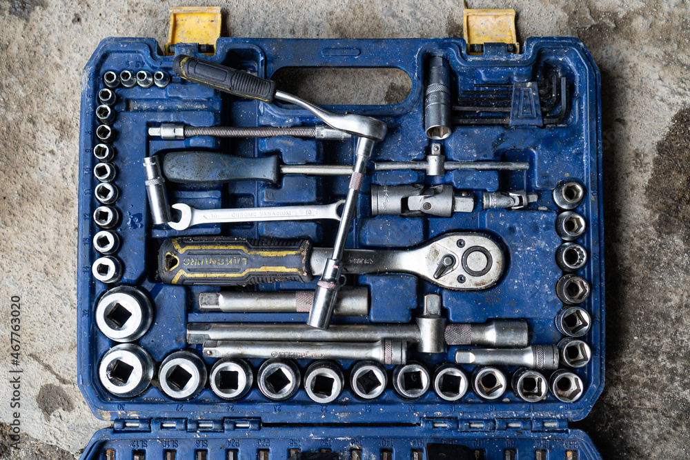a set of wrenches in blue toolbox