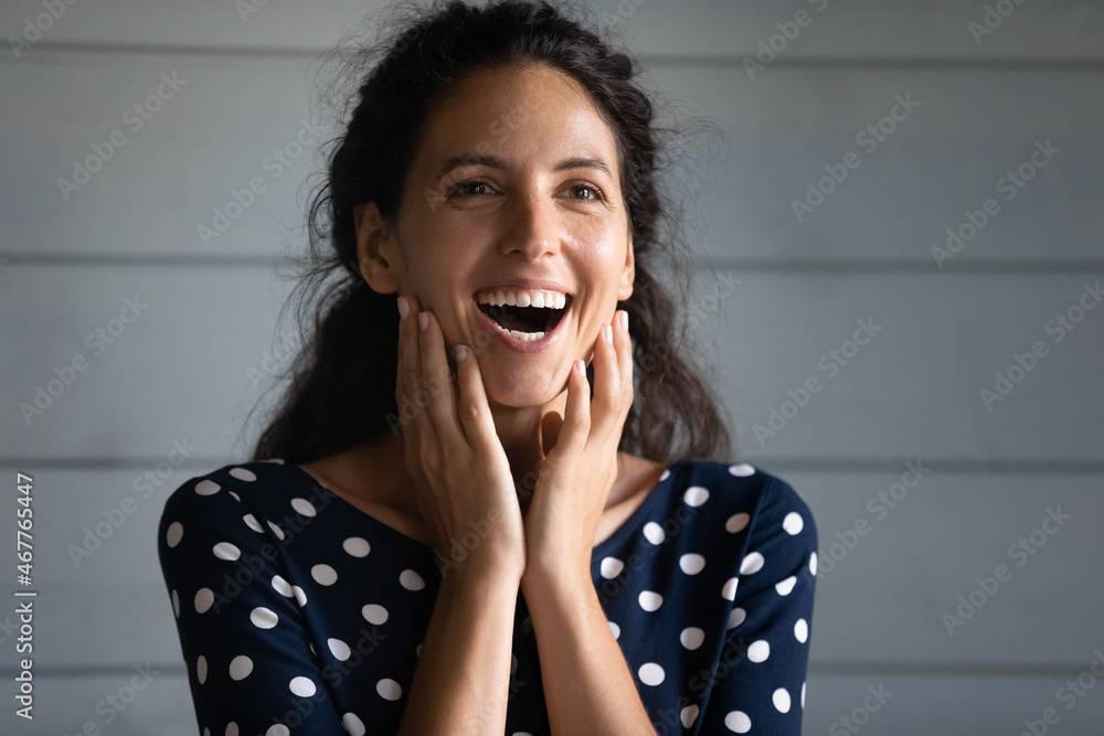 Oh my God. Excited surprised young hispanic woman stand with opened mouth touch cheeks shocked with great sales offer. Astonished latin lady can not believe in fantastic luck unexpected bonus prize Oh my God. Excited surprised young hispanic woman stand with opened mouth touch cheeks shocked with great sales offer. Astonished latin lady can not believe in fantastic luck unexpected bonus prize