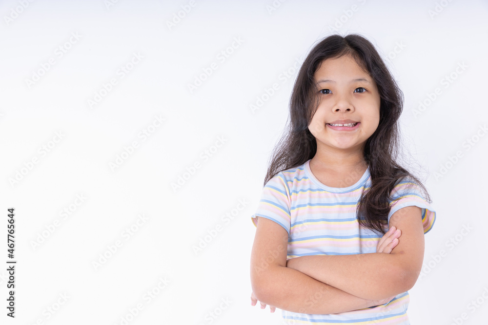 Asian kid girl stands with arms crossed smile happy isolated on white background with copy space. Portrait close-up kid girl she very nice looking, smiling cheery, smart, and confident. Asian kid girl stands with arms crossed smile happy isolated on white background with copy space. Portrait close-up kid girl she very nice looking, smiling cheery, smart, and confident.