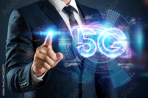 Over hand of businessman 5G hologram, creative background. 5G network concept, high speed mobile internet, new generation networks. Mixed media.