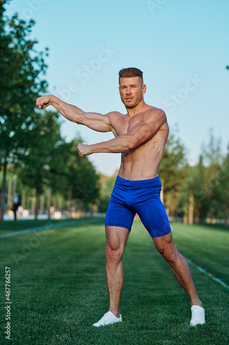 man doing exercises in the park inflated body