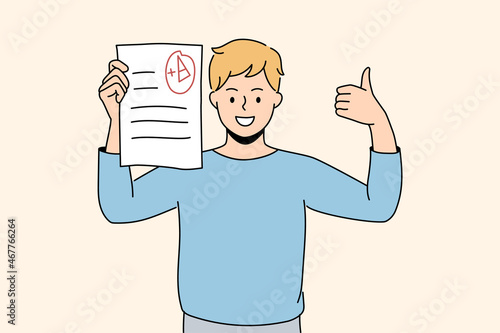 Success in education and learning concept. Smiling boy schoolboy pupil standing holding educational exam with excellent result in hands feeling cheerful vector illustration 