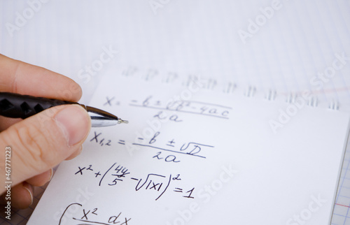 Mathematical equations written in a notebook. Math homework. The concept of education and training