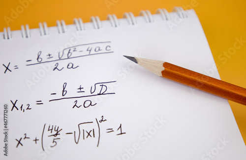 Mathematical equations written in a notebook. Math homework. The concept of education and training