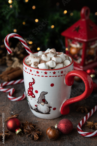Cup of creamy hot chocolate with melted marshmallows and spices  for Christmas holiday