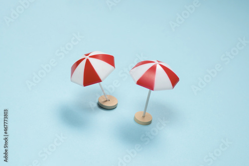 Red umbrella on a blue background.