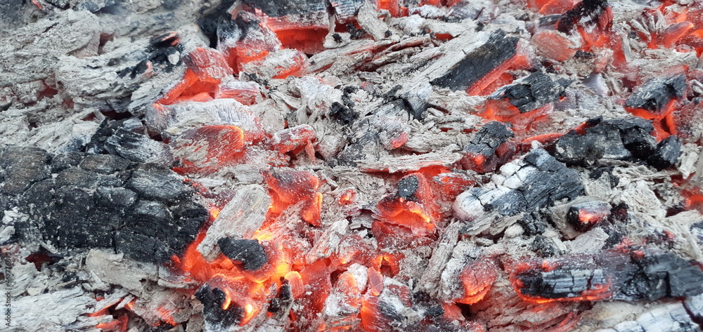 Hot coals and ash. Hot firewood in the grill. Grilling coals. Hot coals and ash. Hot firewood in the grill. Grilling coals.