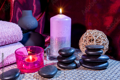 Spa, zen basalt stones, towels, candles in the massage room.