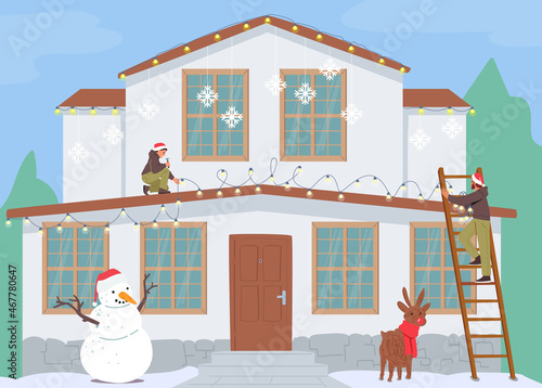 Happy Family Decorate House for Christmas. Father and Son Hang Festive Garland on Home Roof, Decorating Yard