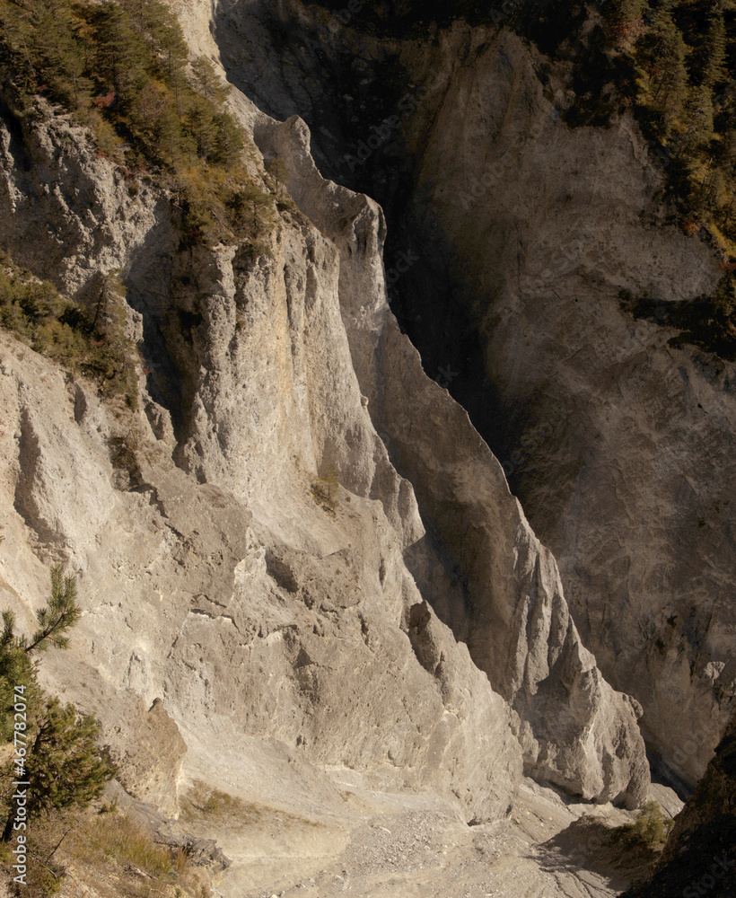 Heavily-eroded wall of the Rhine Gorge near Flims, Switzerland Heavily-eroded wall of the Rhine Gorge near Flims, Switzerland