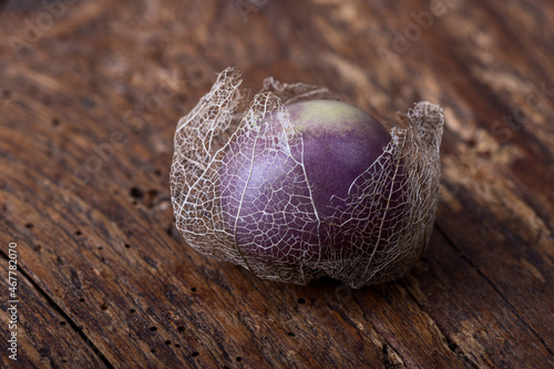 ripe tomatillo fruit on wood photo