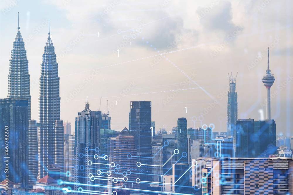 Obraz premium Technology hologram over panorama city view of Kuala Lumpur. KL is the largest tech hub in Malaysia, Asia. The concept of developing coding and high-tech science. Double exposure.