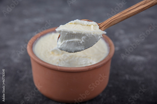 Casserole yogurt. Delicious yogurt scene with wooden bowl and sackcloth. Closeup shot of healthy fresh yogurt. Top view.