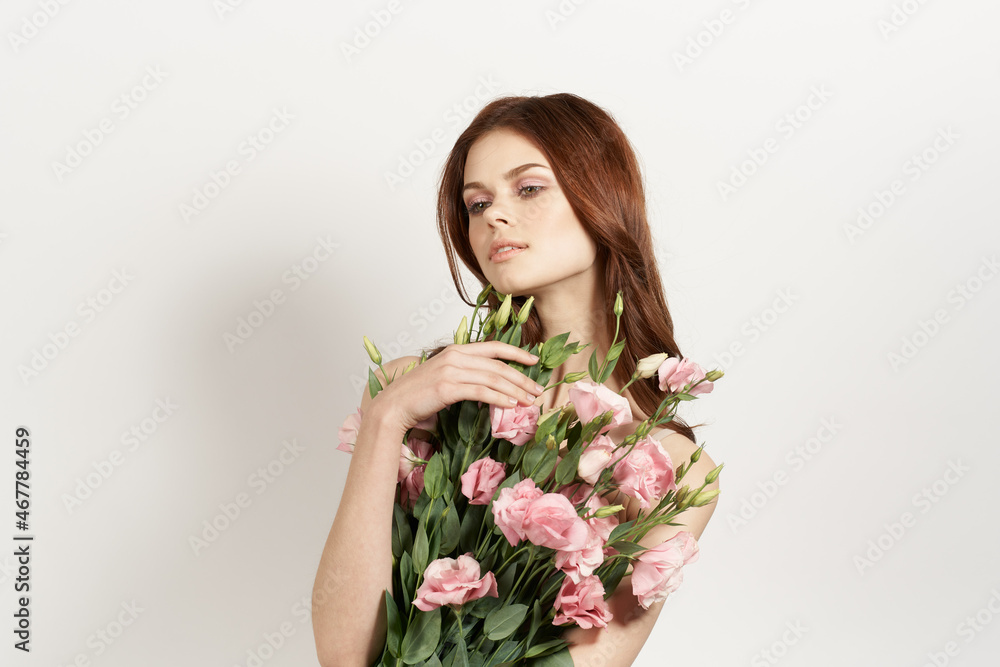 cheerful woman in dress posing flowers makeup isolated background