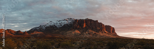 Superstition Mountain in Phoenix, Arizona panorama during sunset in winter with snow