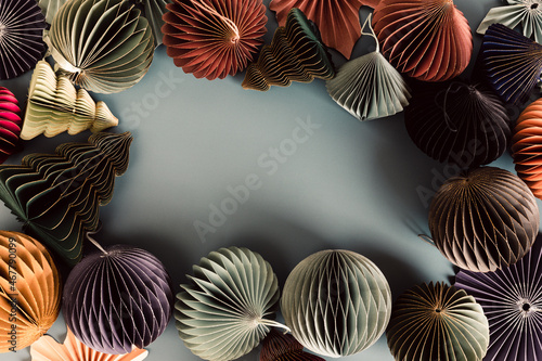 Scandinavian christmas paper honeycomb ornaments. Modern christmas decoration, minimalist and plastic free. Flat lay, top view