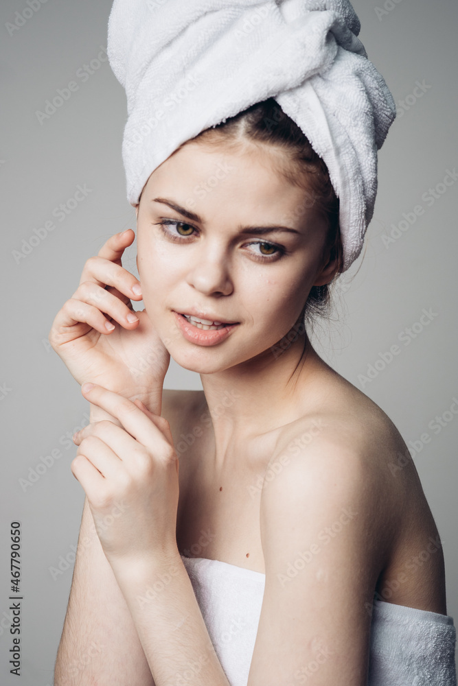 woman after shower with towel on head posing skin care woman after shower with towel on head posing skin care
