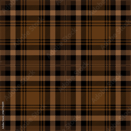 Brown and black tartan plaid. Scottish pattern fabric swatch close-up. 