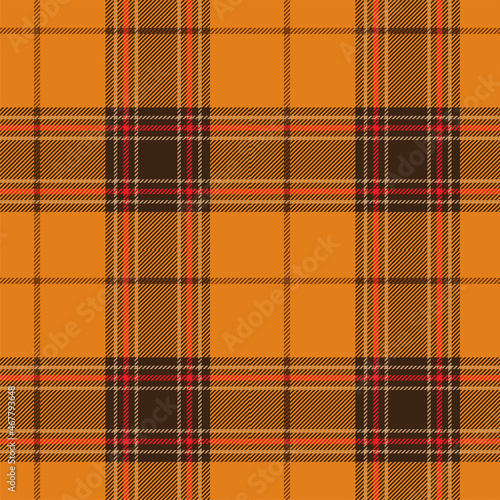 Orange, red and brown tartan plaid. Scottish pattern fabric swatch close-up. 