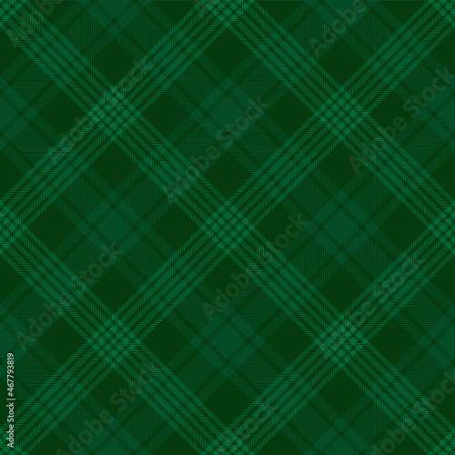 Green tartan plaid. Argyle Scottish pattern fabric swatch close-up. 