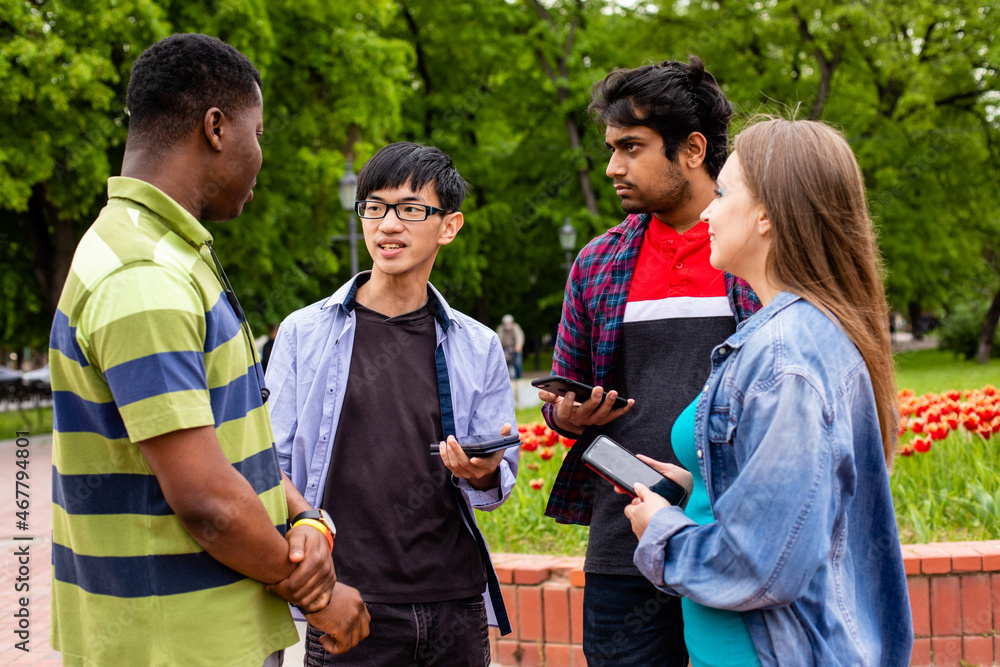Fototapeta premium Communication without borders between cheerful multiethnic students