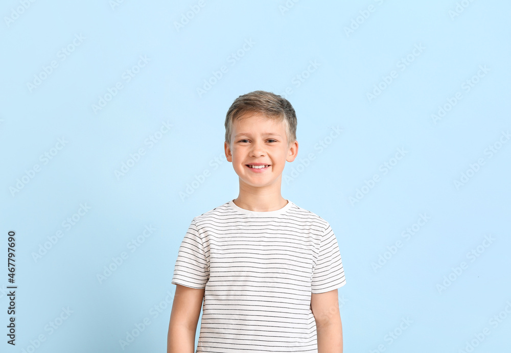 Portrait of smiling little boy on blue background Portrait of smiling little boy on blue background