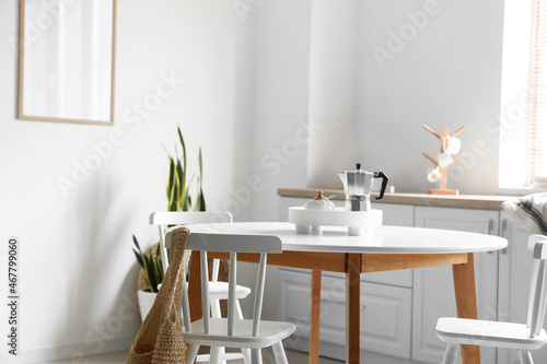 Interior of modern light room with dining table