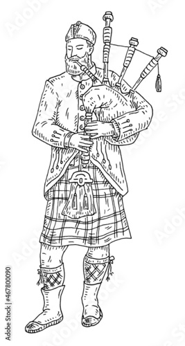 Canvas Print Scottish man dressed in kilt playing traditional bagpipes