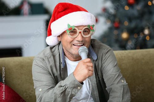 Mature man with microphone ...