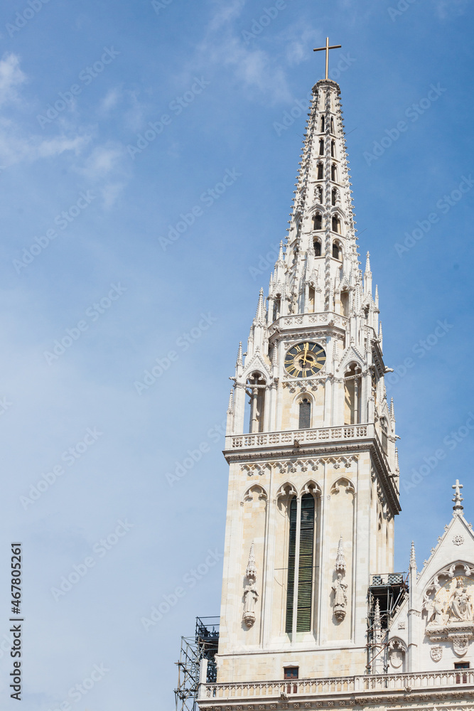 Close up on the gothic clocktower of Zagrebacka Katedrala, or Zagreb cathedral, in afternoon from Kaptol district. This is the biggest catholic church of Croatia and landmark of croatian capital city